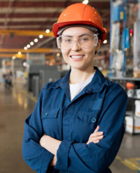 A professional industrial worker wearing safety gear.