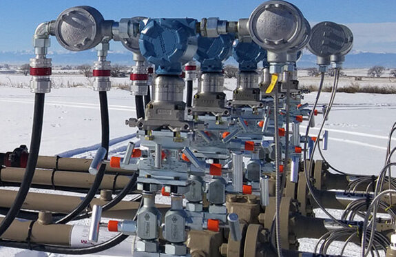 At a terminal facility, storage tanks require a network of piping connections to control fluid flow around the tank farm. 