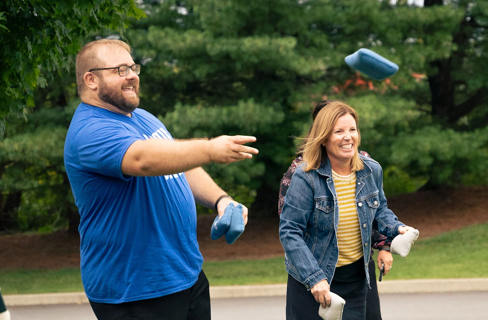 Playing cornhole at our End of Summer Carnival