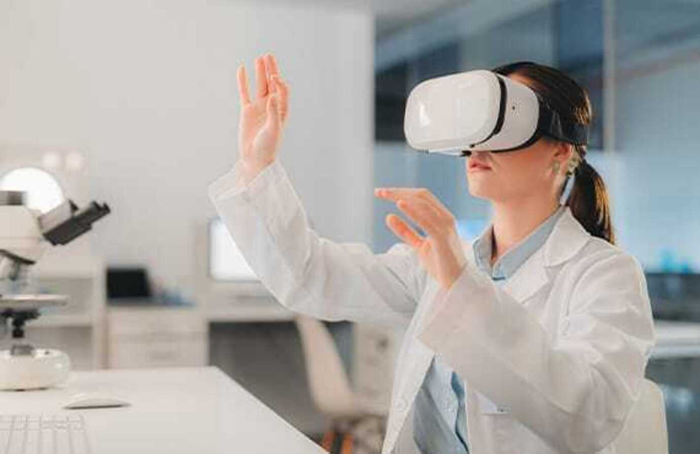 Female scientist in a lab wearing VR glasses, exploring digital transformation in life sciences operations.