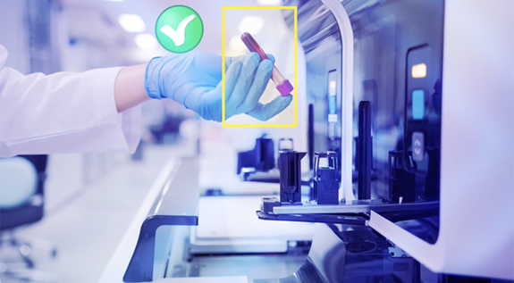 Engaged worker holding a test tube
