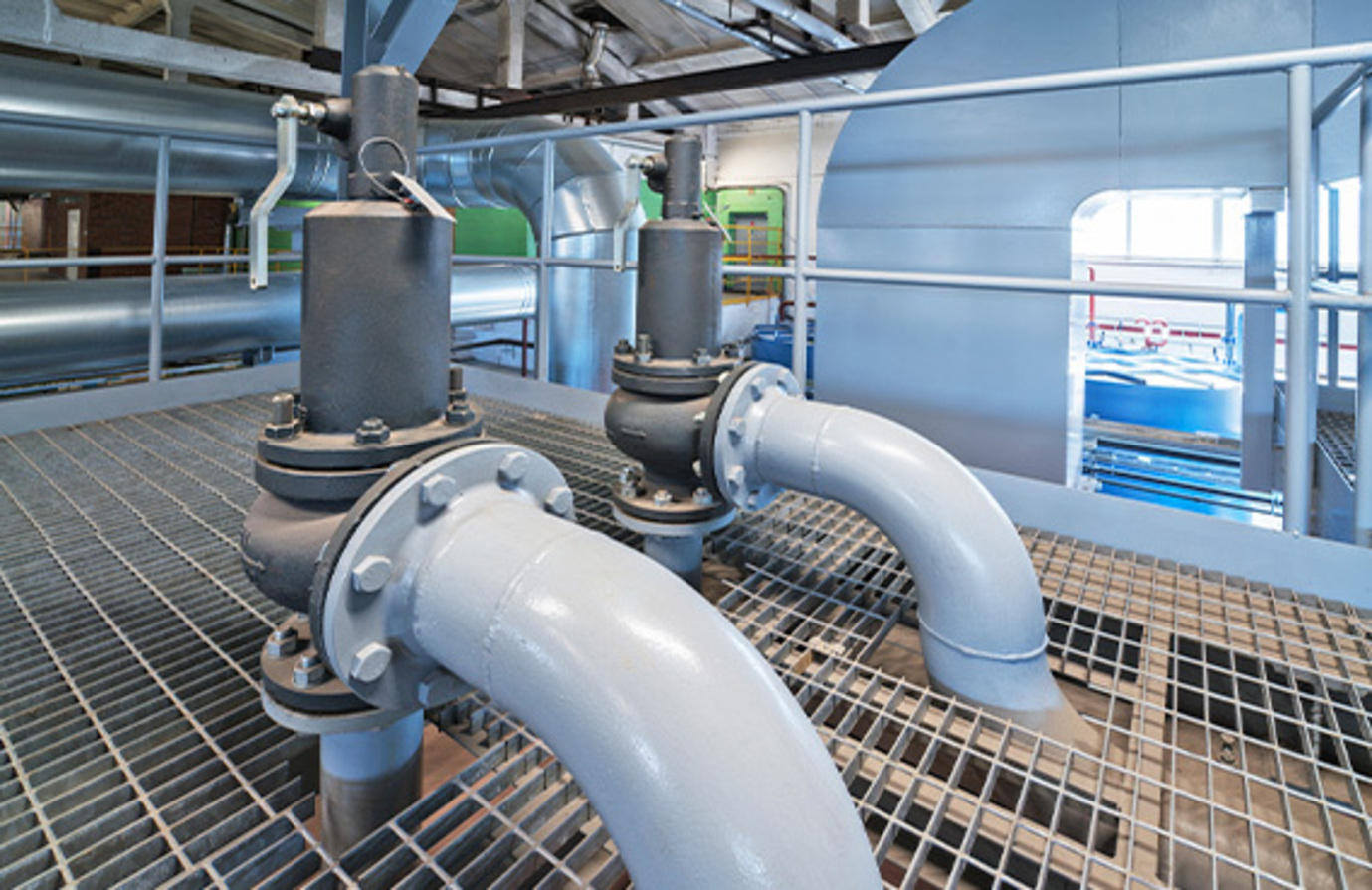 A close-up view of a faucet, with a focus on its components, including a safety relief valve. The image illustrates the faucet's design and functionality, emphasizing the importance of the safety relief valve in preventing water pressure issues.