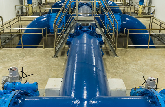 Blue pipes in a large factory with Advanced Filtration Systems.