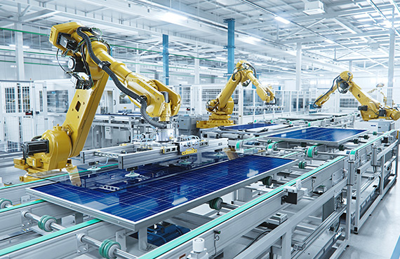 Robots efficiently installing solar panels in an industrial plant.