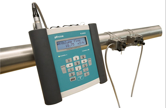 A flexim fluxus flow meter installed on a pipe