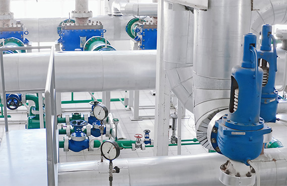 Variety of blue Crosby Pressure Relief Valves sitting on a pallet