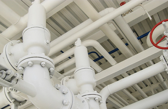 A detailed image of a steel spring safety valve, an essential component for oil refining equipment. The valve is showcased in a close-up view, highlighting its design and functionality in industrial applications.