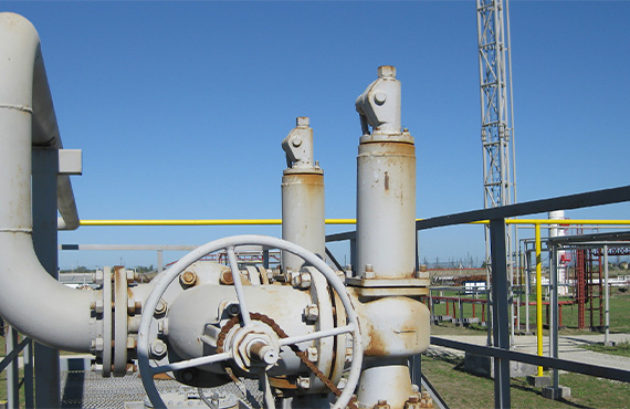A close-up view of a steel spring safety valve, showcasing its intricate design and components. The image emphasizes the function of relief valves in regulating pressure and ensuring safety in various industrial applications.
