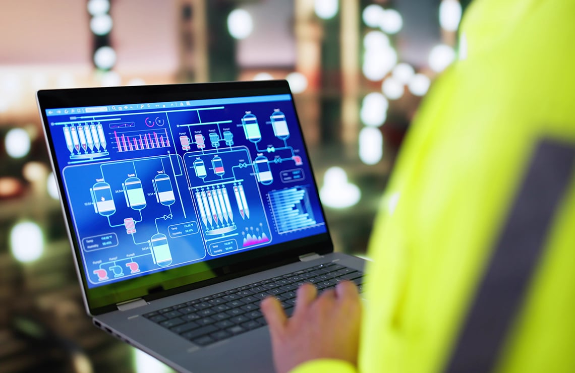 Petrochemical plant manager using an automated health system on a laptop
