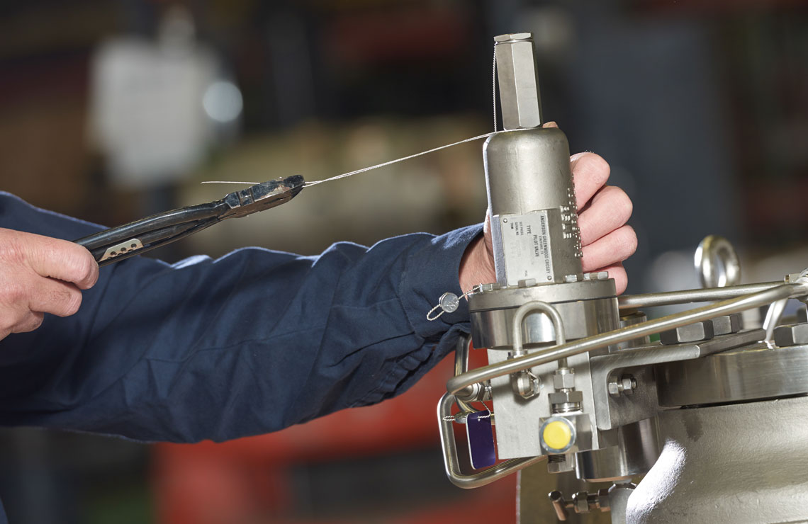 Pressure relief valve being repaired