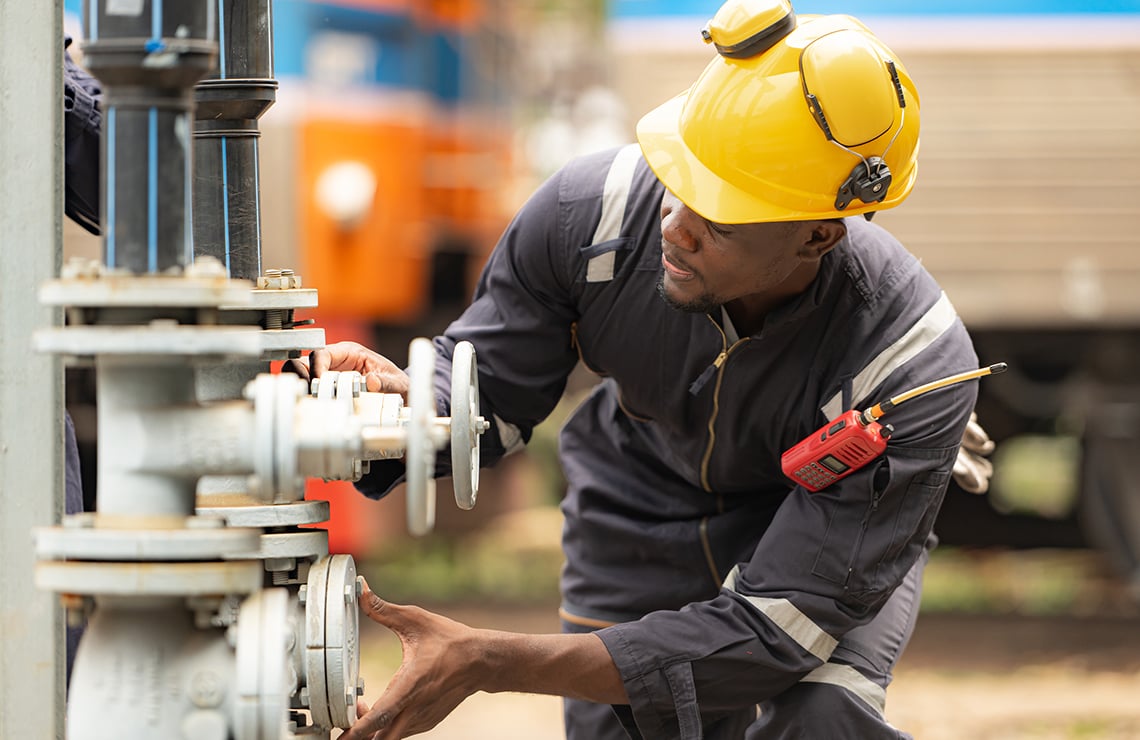 Safety engineer inspecting a control valve
