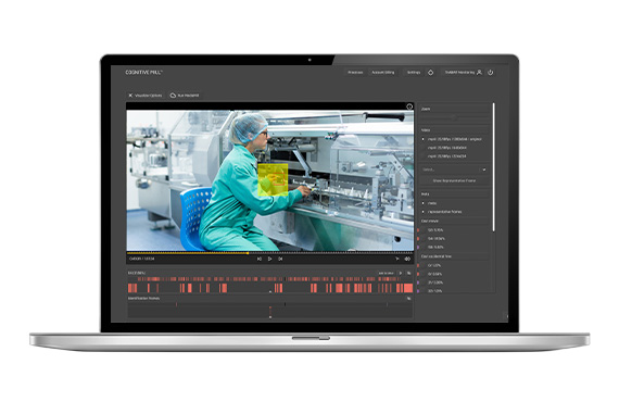 Laptop screen displaying a woman working on manufacturing equipment