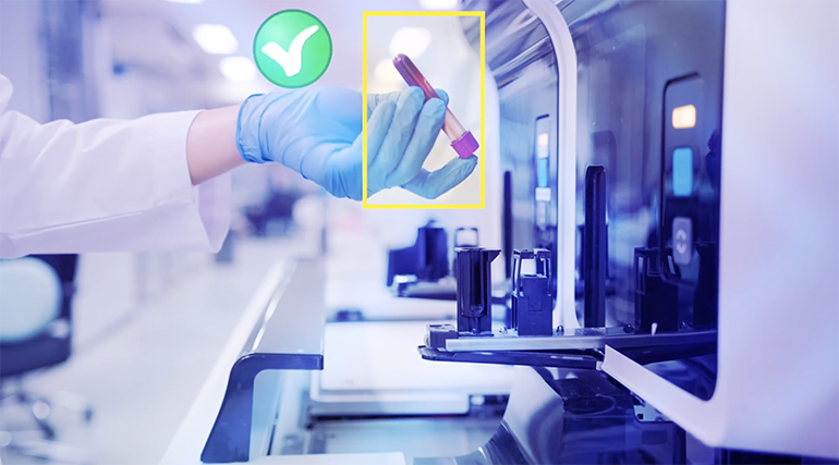 Engaged worker holding a test tube